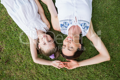 Mother and daughter smiling at camera