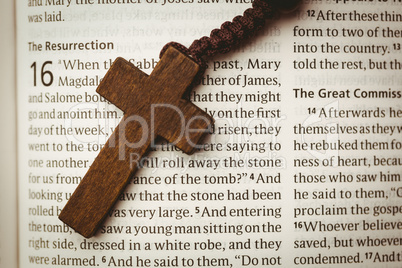 Open bible and wooden cross