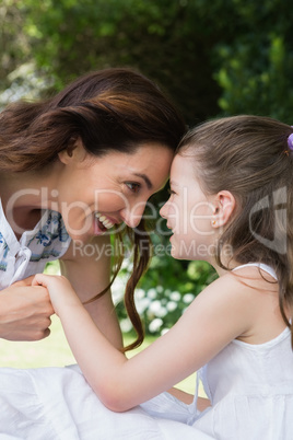 Mother and daughter smiling at each other