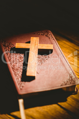 Crucifix icon resting on the bible