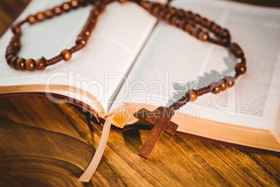 Open bible with rosary beads