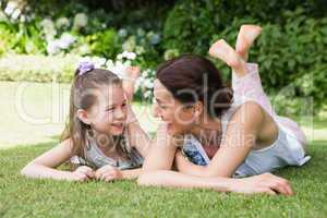 Mother and daughter smiling at each other