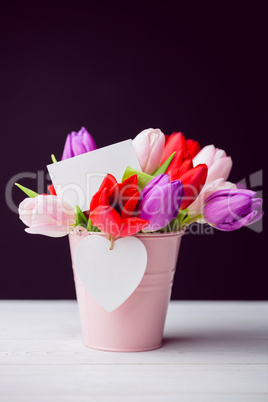 Bunch of tulips and white card