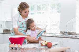 Mother and daughter baking together