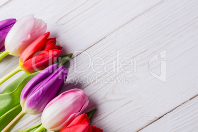 Tulips on wooden table