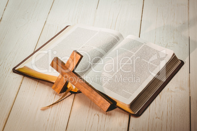 Open bible and wooden cross