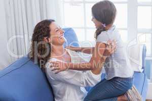 Happy mother and daughter having fun