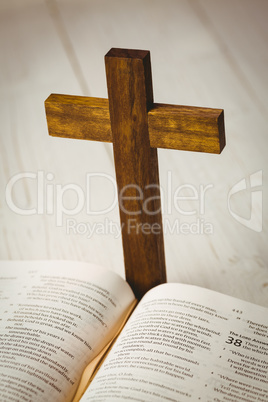 Open bible and wooden cross