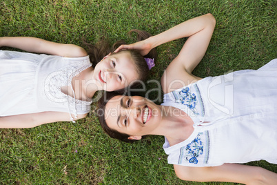 Mother and daughter smiling at camera