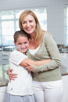 Happy mother and daughter hugging