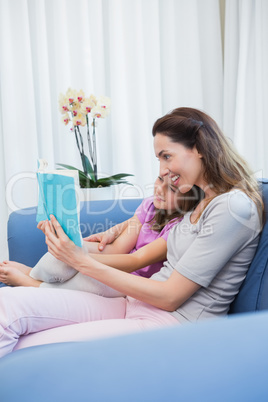 Mother and daughter reading a book