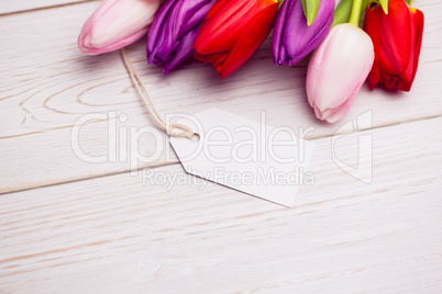 Bunch of tulips and white card