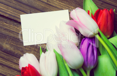 Bunch of tulips and white card