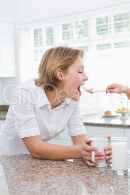 Mother and daughter having breakfast