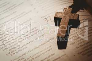 Open bible and wooden rosary beads