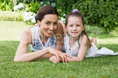 Mother and daughter smiling at camera