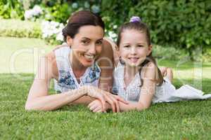 Mother and daughter smiling at camera