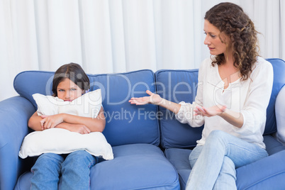 Upset mother looking at her daughter