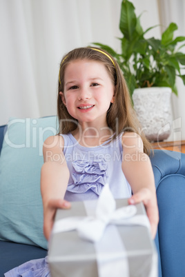 Little girl holding a gift