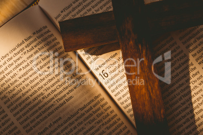 Open bible and wooden cross