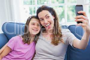 Mother and daughter taking a selfie