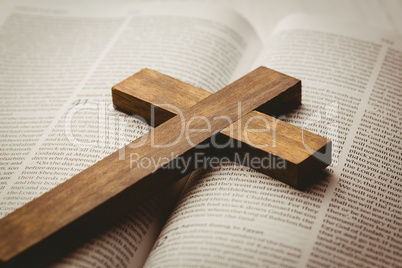 Open bible and wooden cross