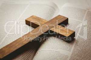 Open bible and wooden cross