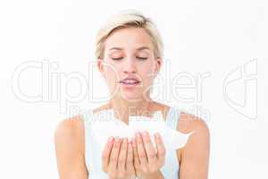 Sick woman holding tissues