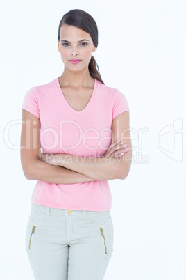 Serious woman looking at camera with arms crossed