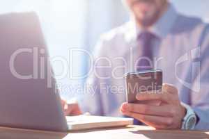 Businessman using laptop at desk