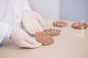 Scientist examining beefsteak