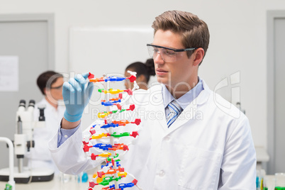 Scientist making DNA helix