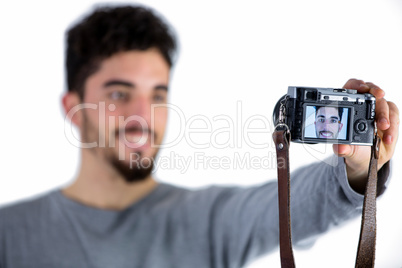 Casual man taking a selfie