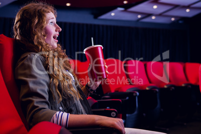 Young woman watching a film