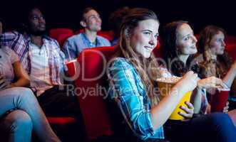 Young friends watching a film