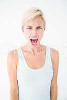 Angry blonde woman screaming