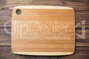 Chopping board on wooden table