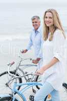 Happy couple cycling together