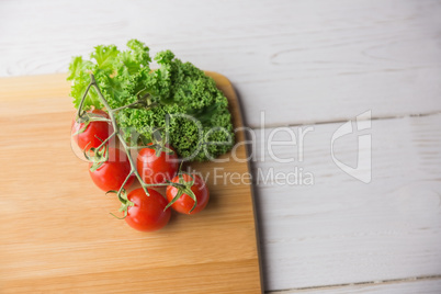 Chopping board tomatoes and parsley