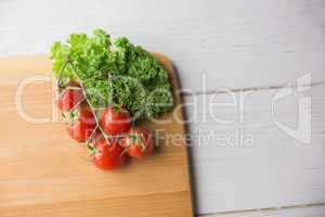 Chopping board tomatoes and parsley