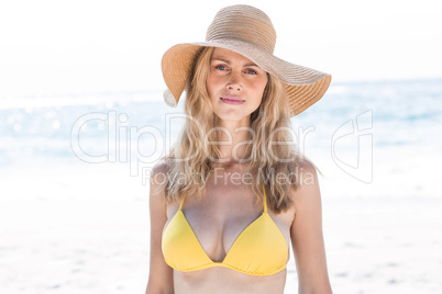 Smiling pretty blonde in bikini looking at camera