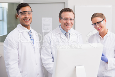 Scientists smiling and looking at camera