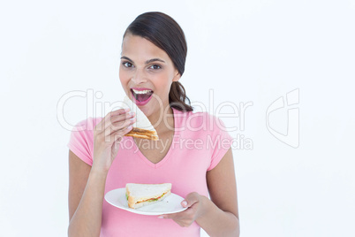 Beautiful woman eating sandwich