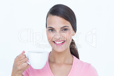 Pretty brunette drinking cup of coffee