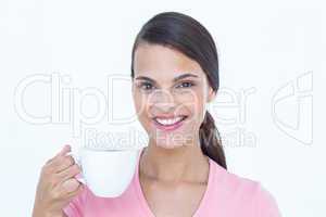 Pretty brunette drinking cup of coffee