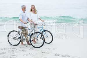 Happy couple cycling together