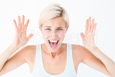 Angry blonde screaming with hands up