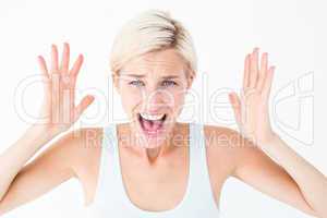 Angry blonde screaming with hands up