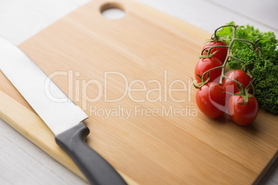 Chopping board tomatoes and parsley