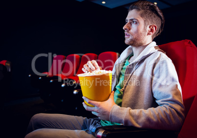 Young man watching a film